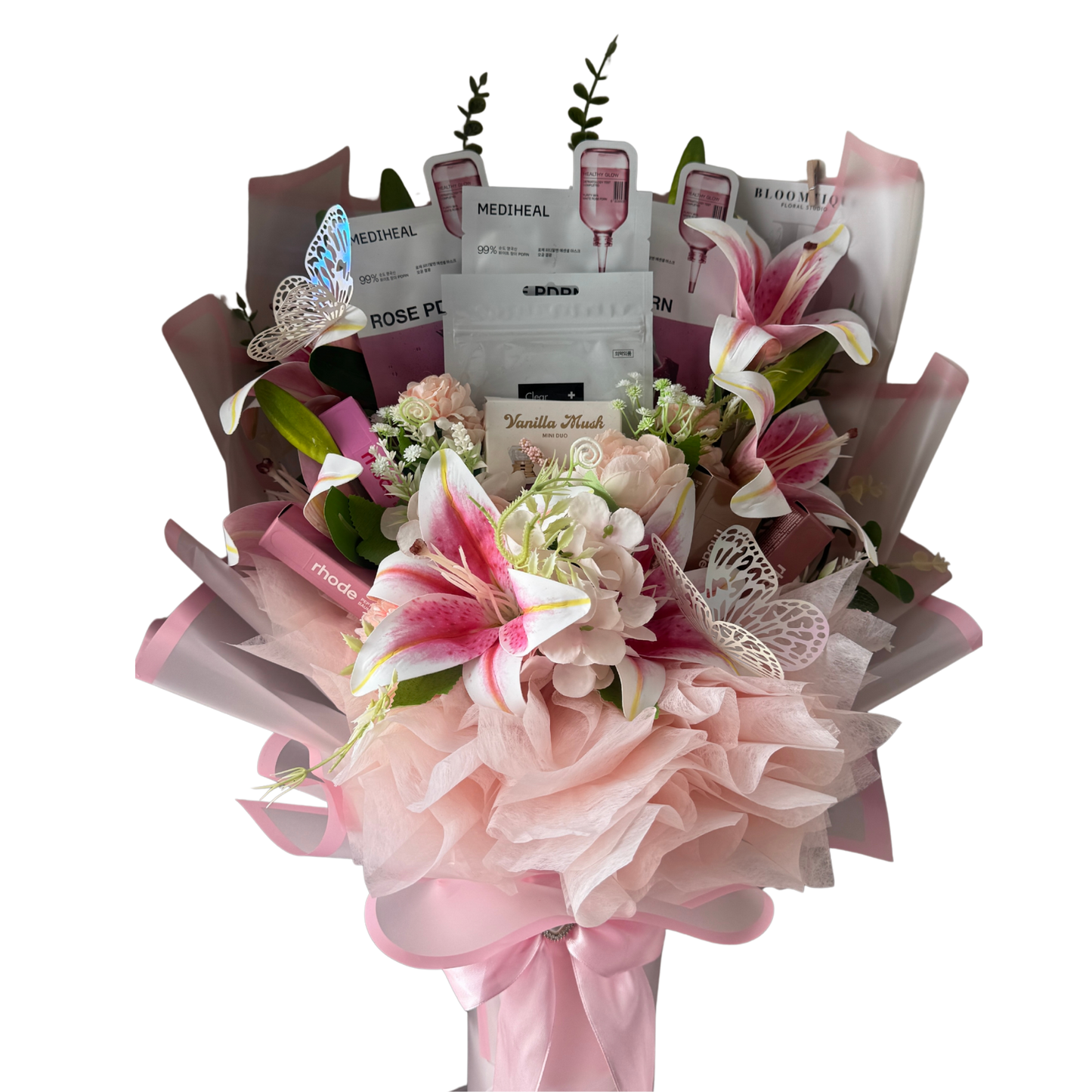 Bouquet of flowers with beauty products wrapped in it on a white background