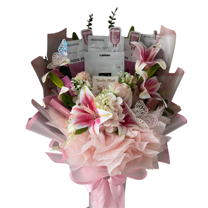 Bouquet of flowers with beauty products wrapped in it on a white background